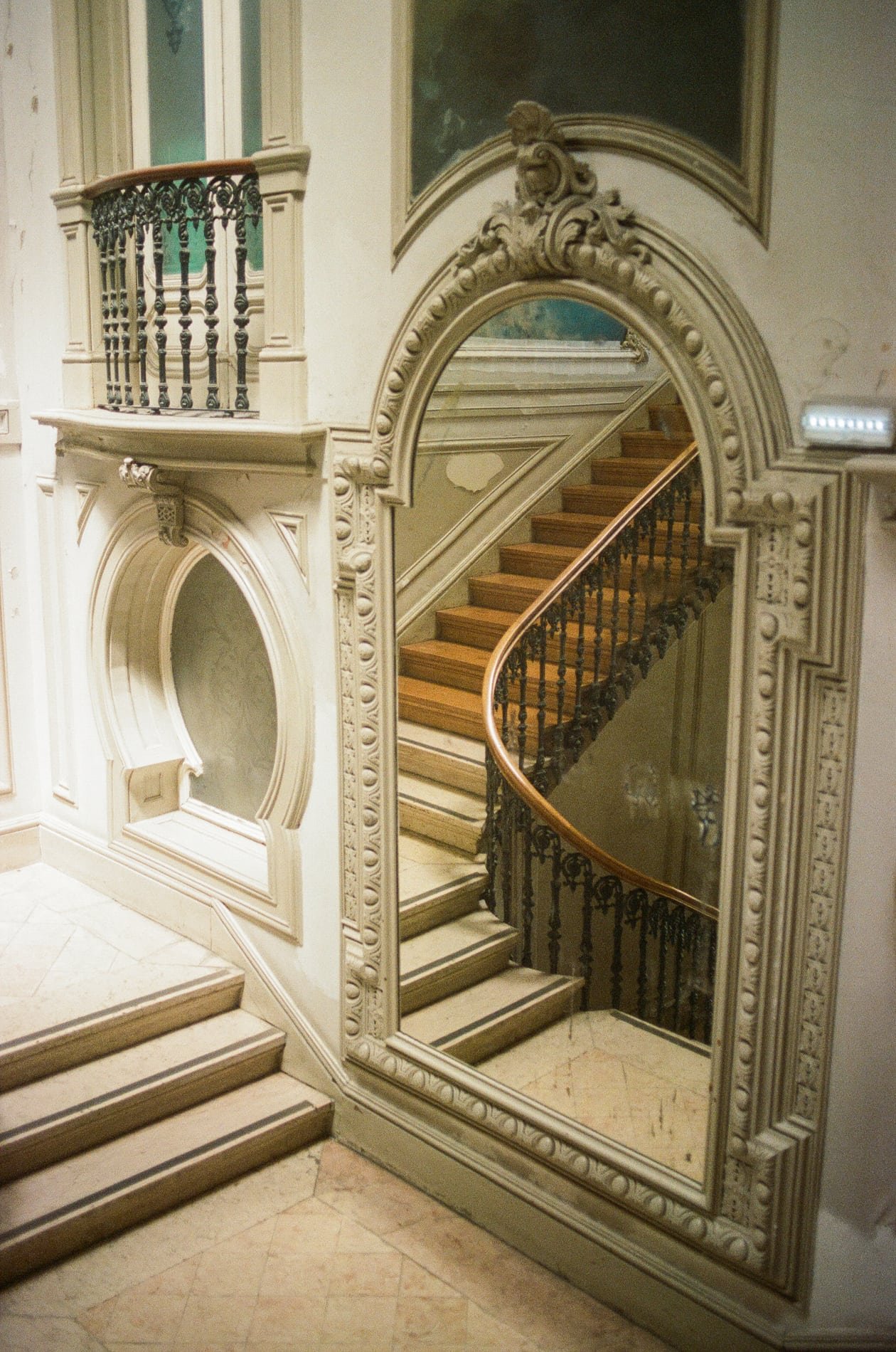 Ornate staircase and mirror