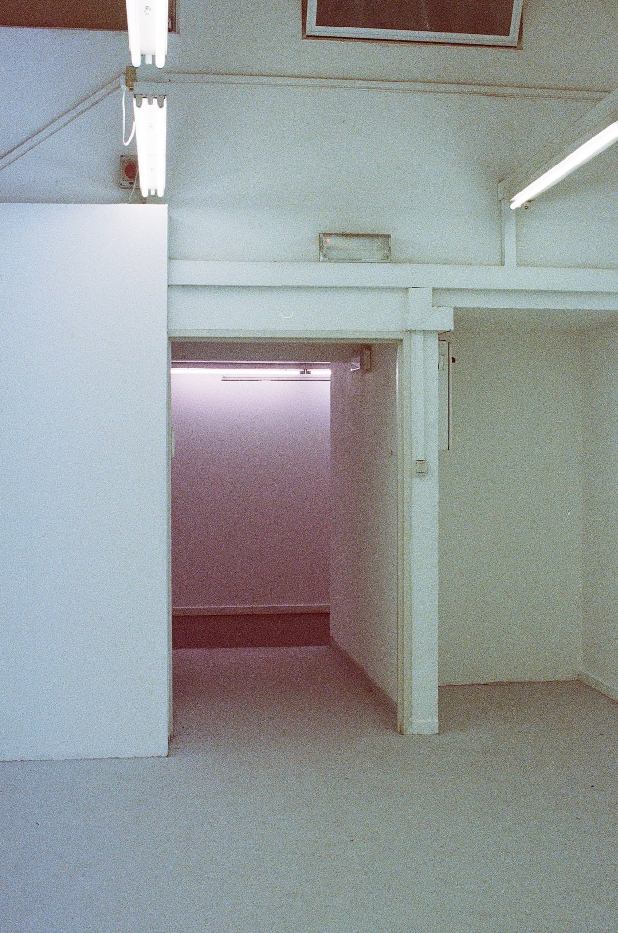 White interior corridor with light